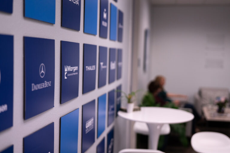 Company logos on the LeanDNA wall