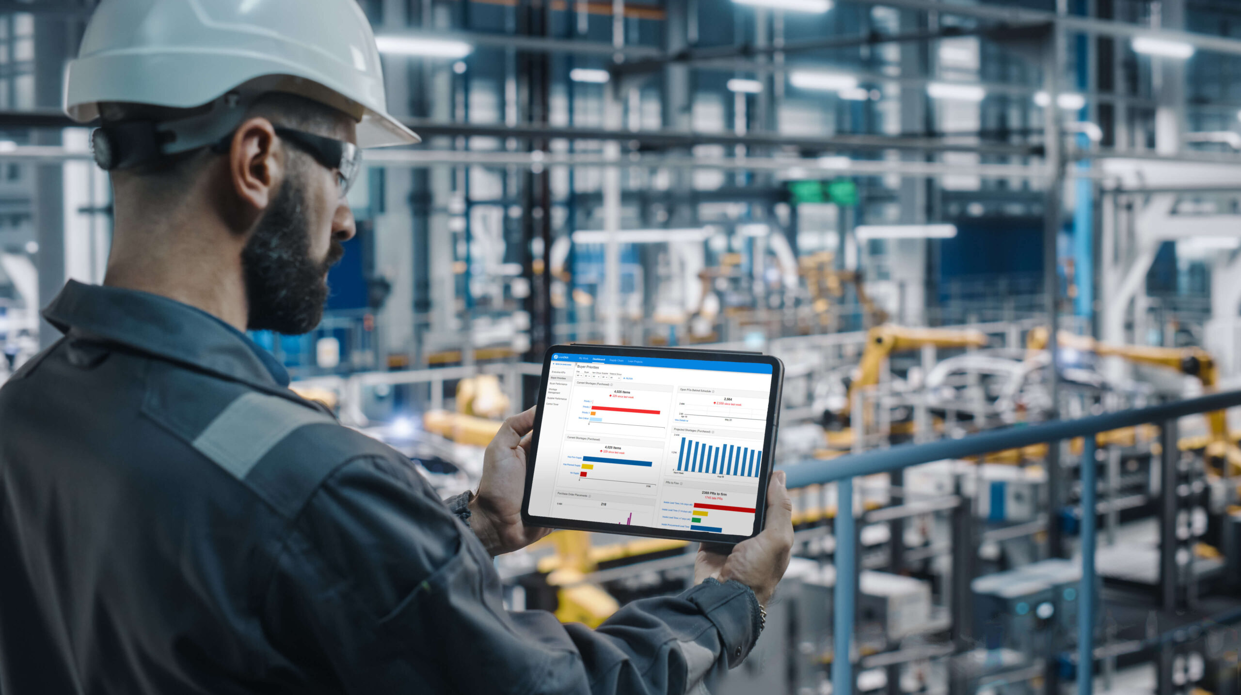 Factory worker looking at the buyers' priorities dashboard