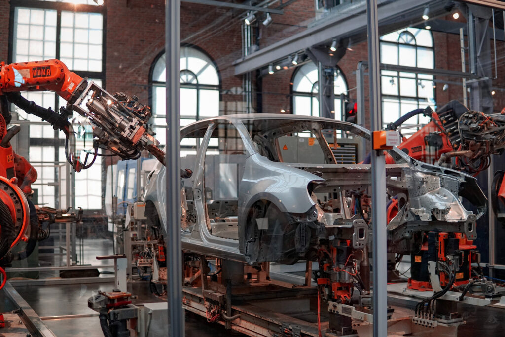 automotive manufacturing in progress by a robot arm